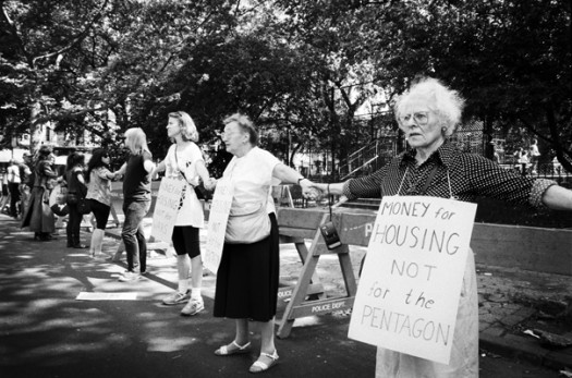 Surrounding Tompkins Square Park, Lower East Side residents protest the forceful closure of Tompkins Square Park. June 1991.