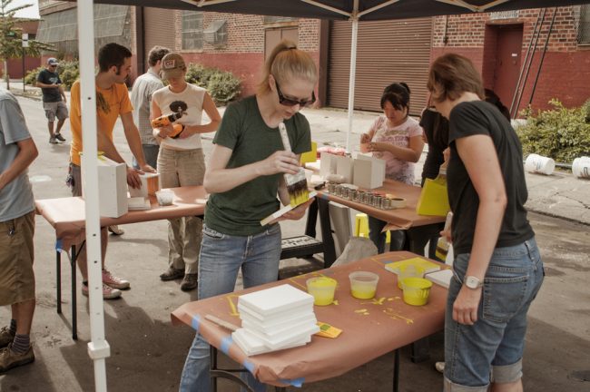 Community volunteers paint and assemble birdhouses at one of the Gowanus Canal Conservancy's community Clean and Green days in 2009.